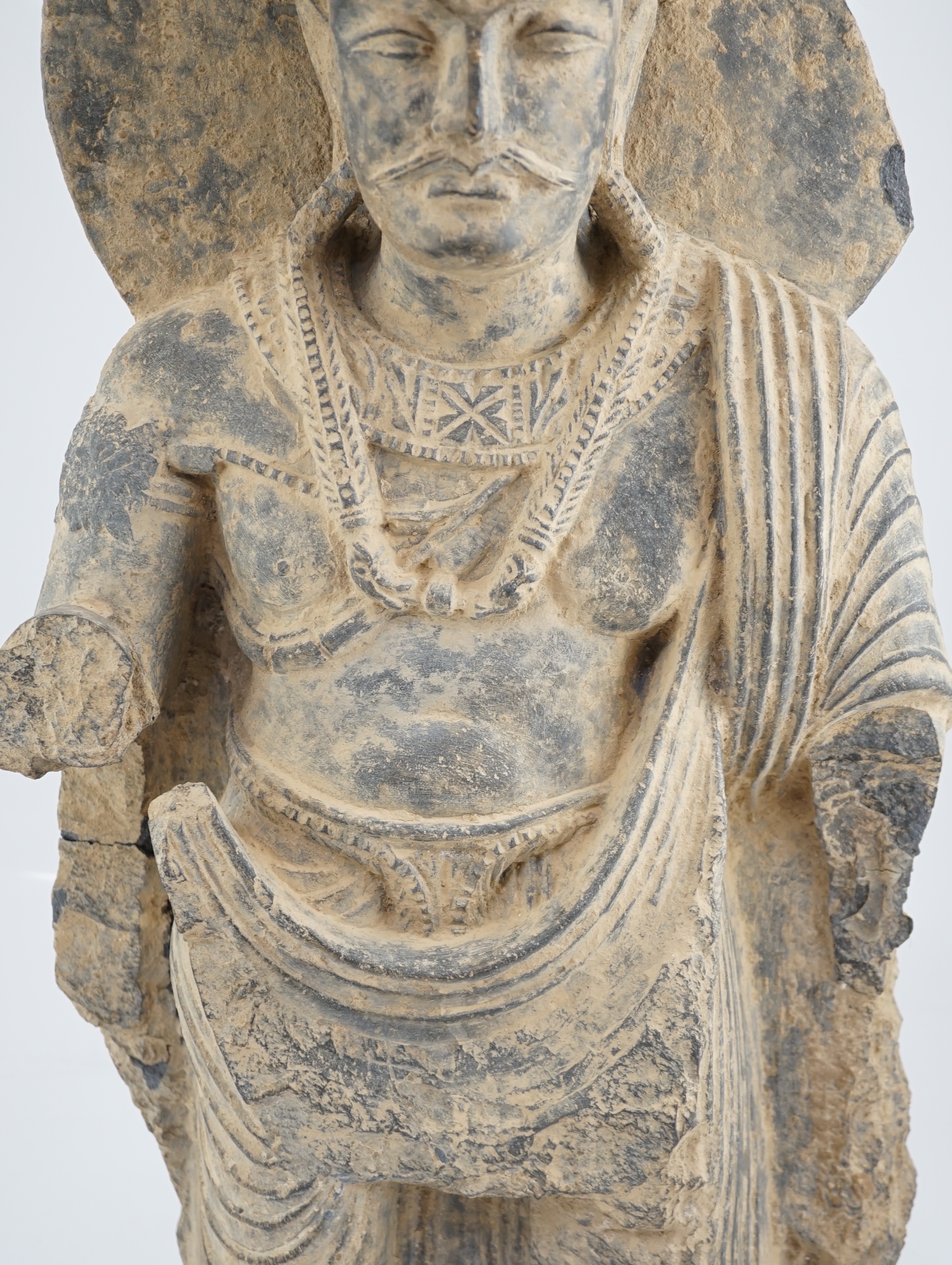 A large grey schist Bodhisattva figure, Gandhara, 2nd/3rd century A.D.